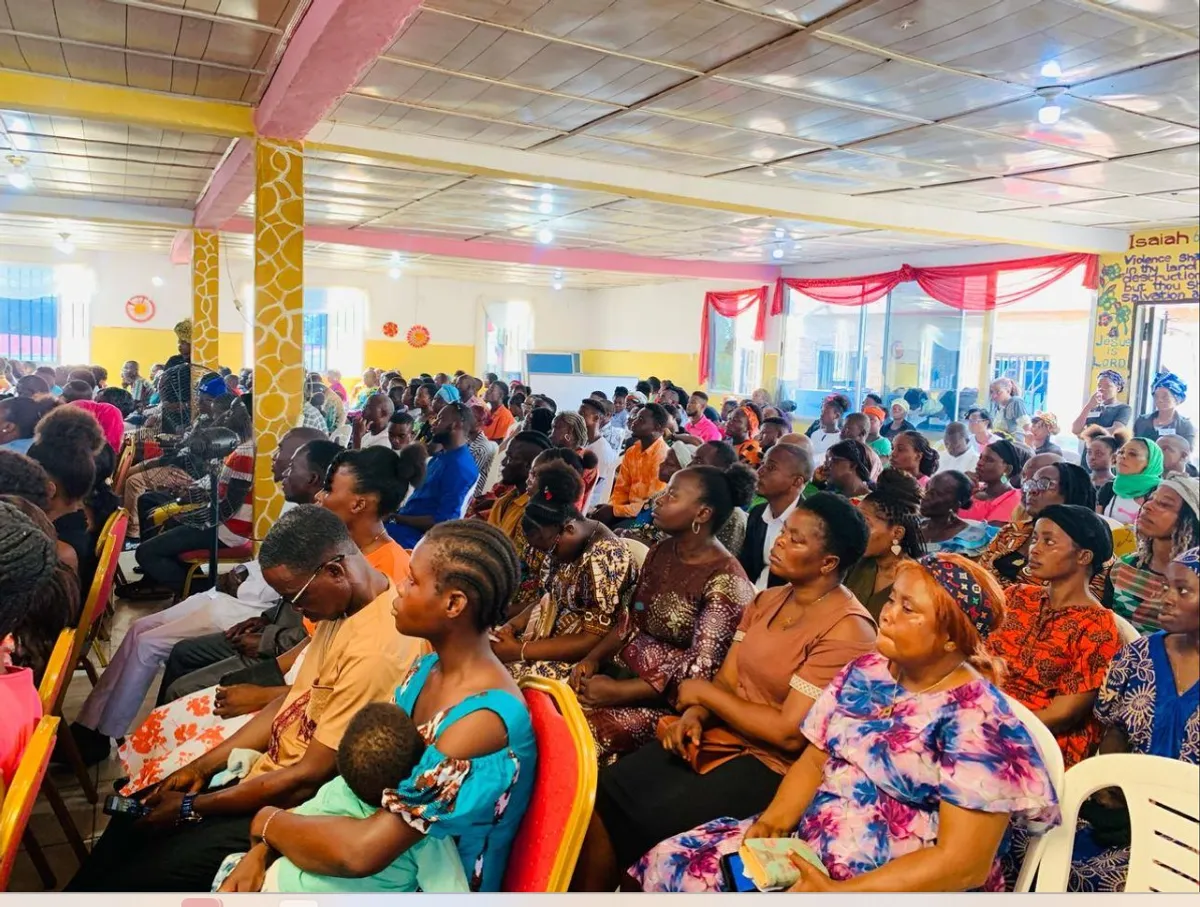 white wall with paintings on wall