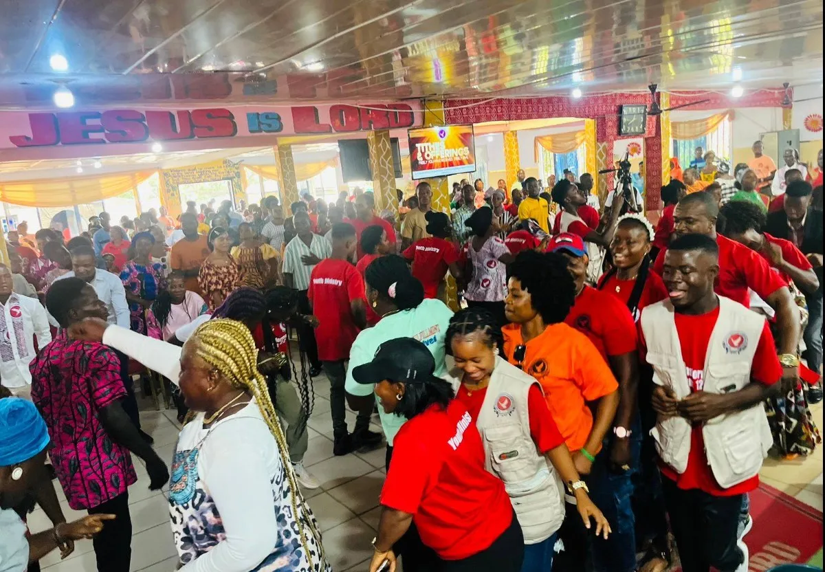 brown loveseat surrounded by photo frame lot